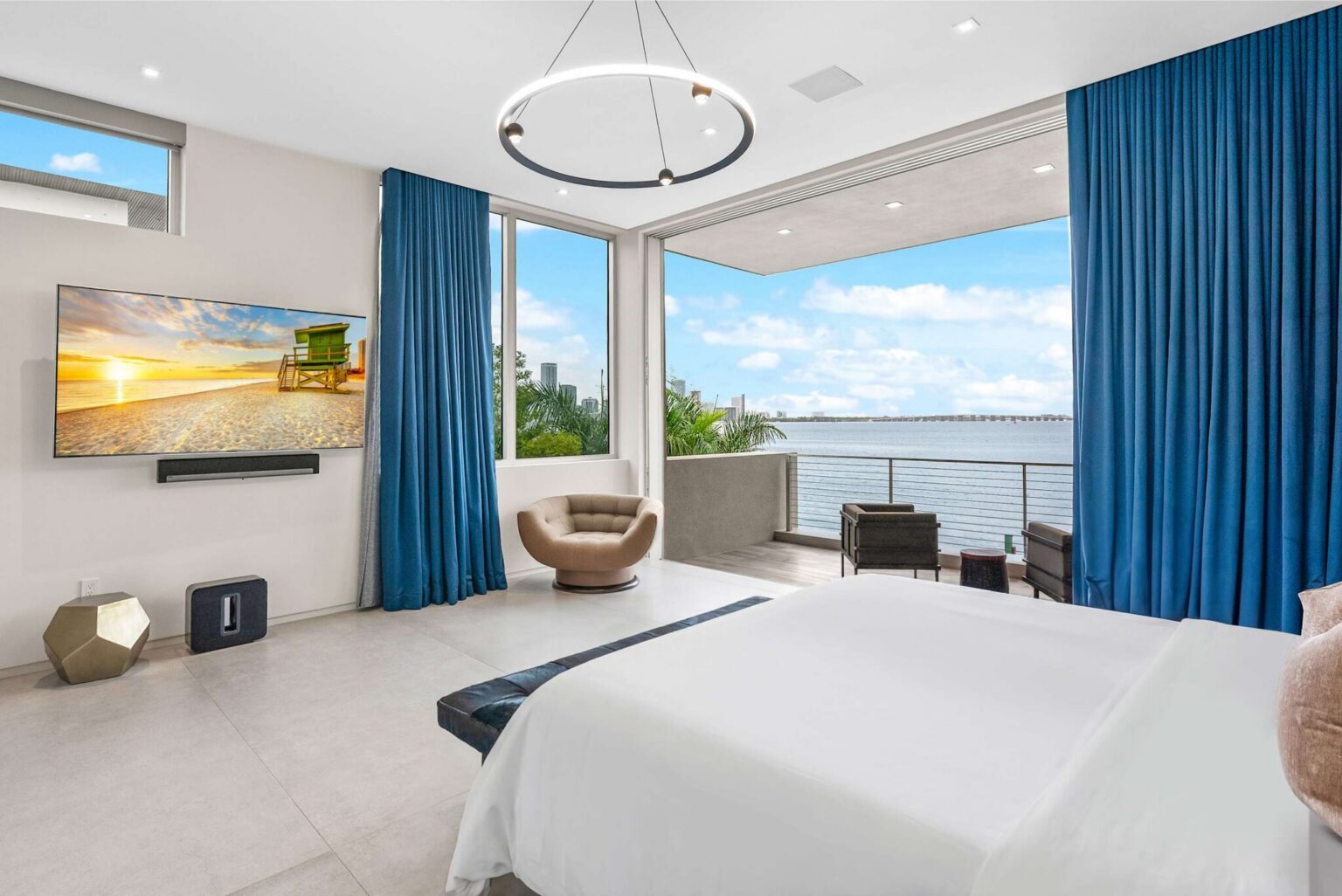 Framed by expansive glass and endless blue horizons, this suite offers an unforgettable luxury waterfront experience.