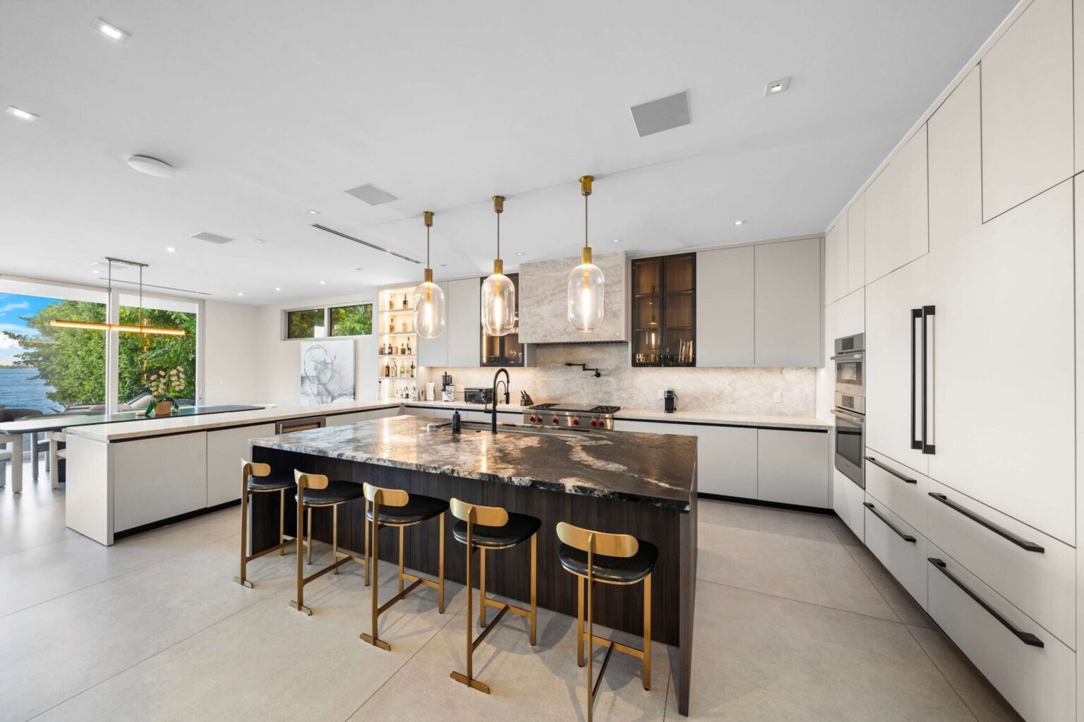 An exceptional gourmet kitchen boasting clean lines, bespoke cabinetry, and elegant architectural details.