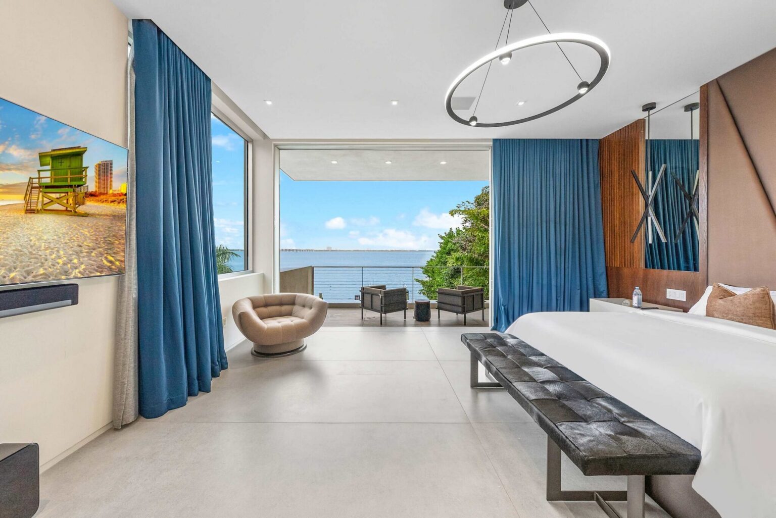 Seamlessly connected to the outdoors, this grand primary retreat invites you to enjoy sunrise views from the comfort of your bed.