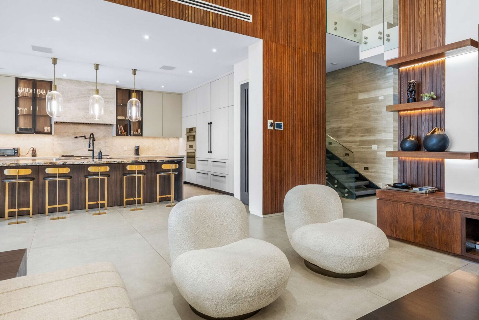 A stunning designer residence featuring a grand chef’s kitchen, custom millwork, and sophisticated open-concept living.