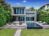 Modern luxury living with a stunning pool, expansive patio, premium loungers, and lush tropical surroundings.