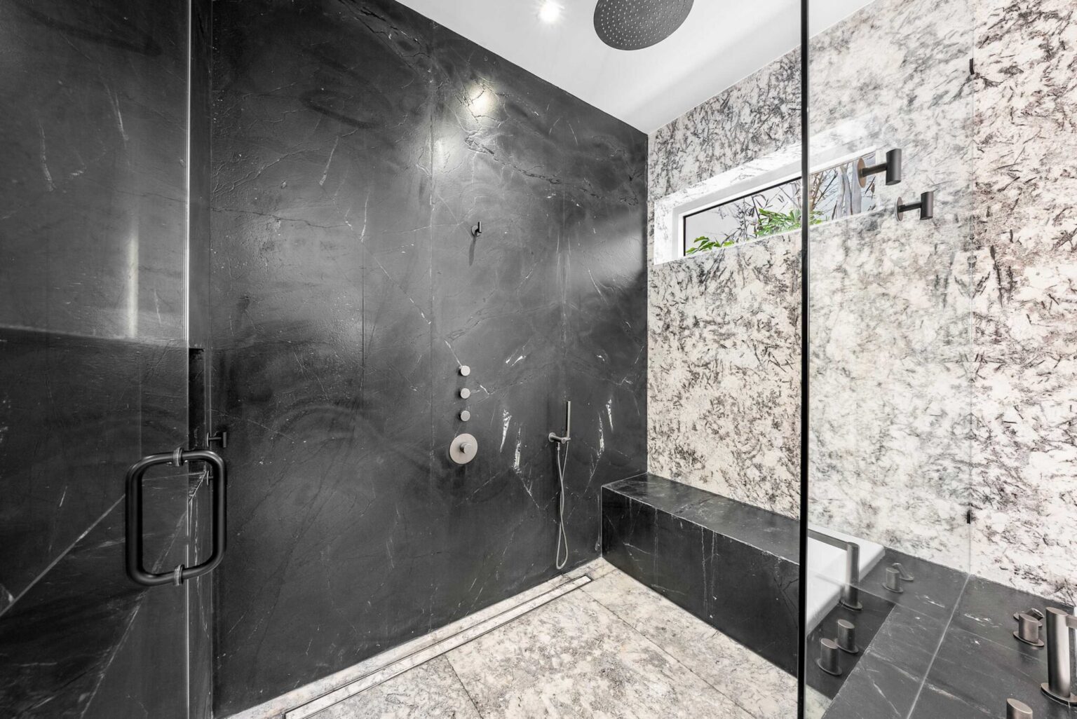 Designed for ultimate relaxation, this expansive shower retreat showcases premium materials and sophisticated modern elegance.