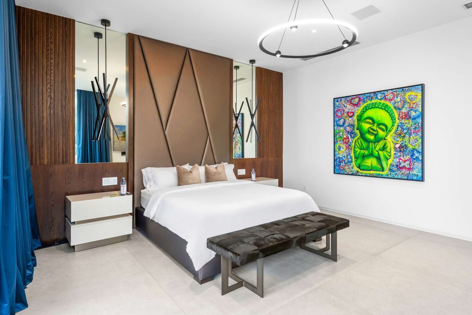 A statement primary bedroom where bespoke finishes, curated artwork, and premium comfort create an elevated living experience.