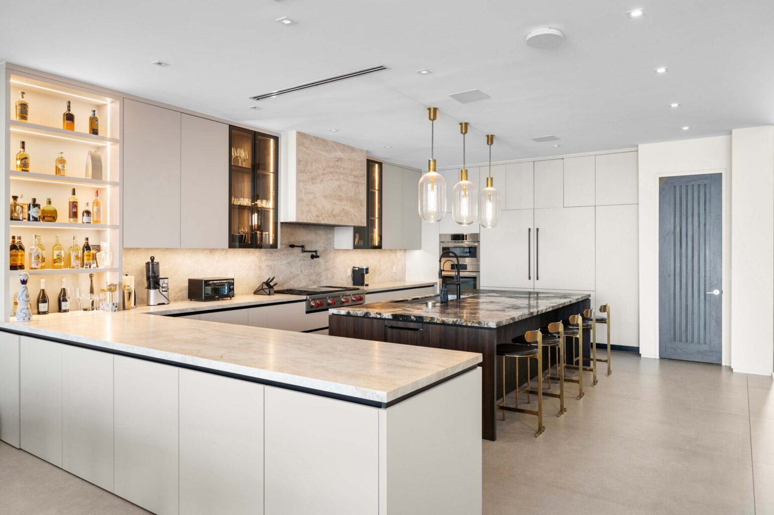 Exceptional open-concept kitchen boasting dual prep areas, custom millwork, and refined elegance.