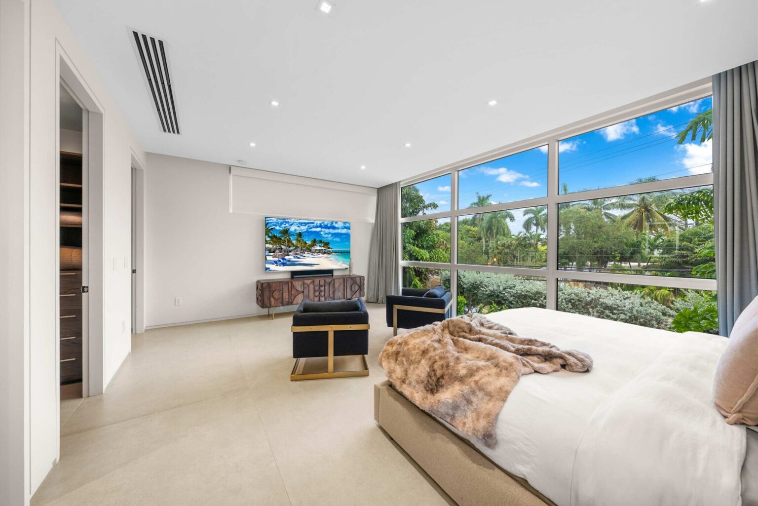 Wake up surrounded by palm-lined vistas in this expansive retreat designed for relaxation, privacy, and elevated living.