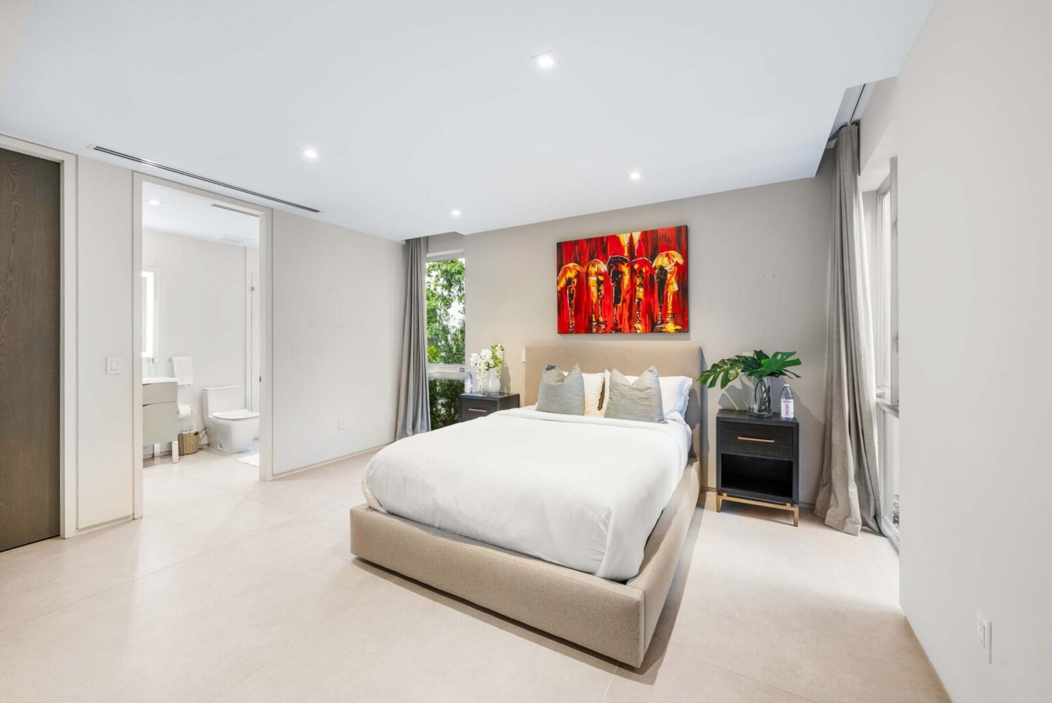 A beautifully appointed guest suite featuring refined finishes, a spa-inspired en-suite bath, and serene contemporary elegance.