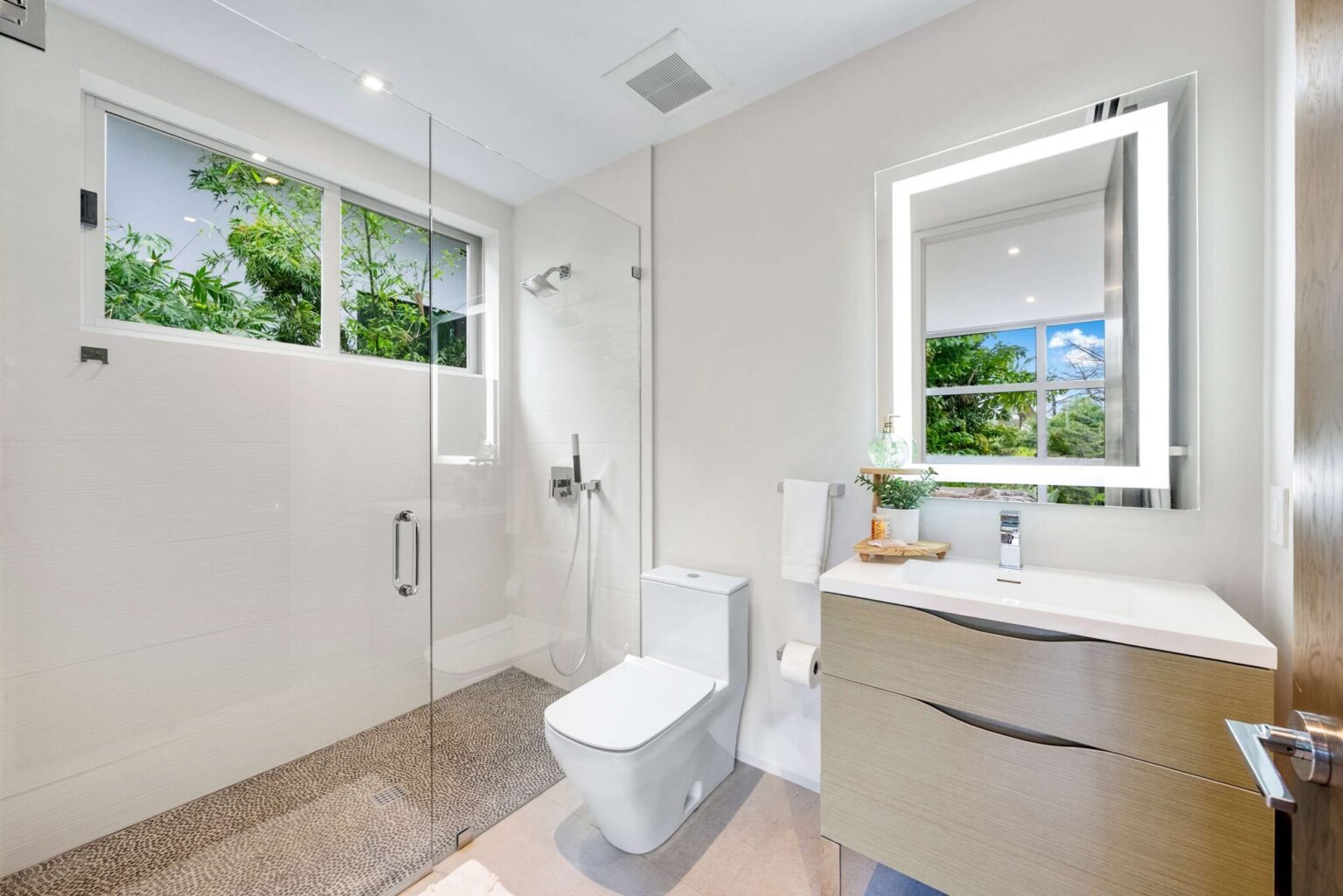 Bright and beautifully appointed, this elegant bathroom blends contemporary design with style comfort.