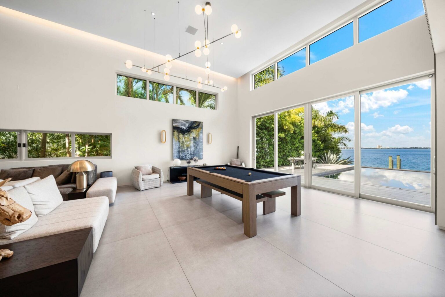 Contemporary waterfront living with soaring ceilings and seamless access to outdoor terraces.