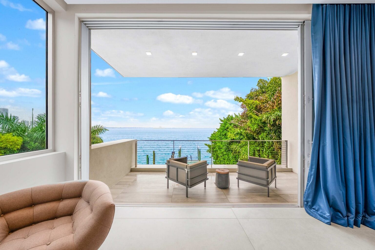 Seamless indoor-outdoor living reaches its finest expression with a private waterfront terrace overlooking endless bay views.