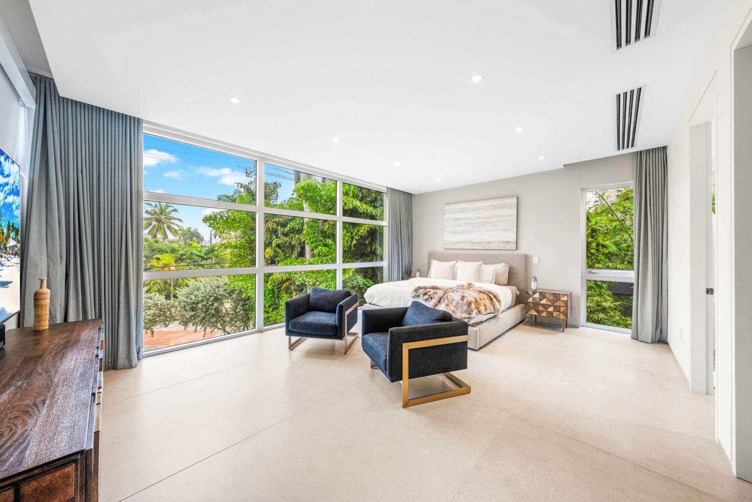 A private sanctuary where indoor elegance meets the beauty of the surrounding tropical landscape.