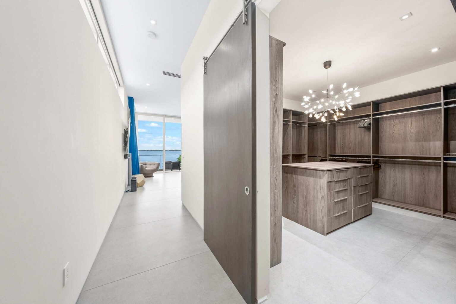 Luxury meets functionality in this expansive wardrobe suite, crafted with bespoke finishes and exceptional attention to detail.