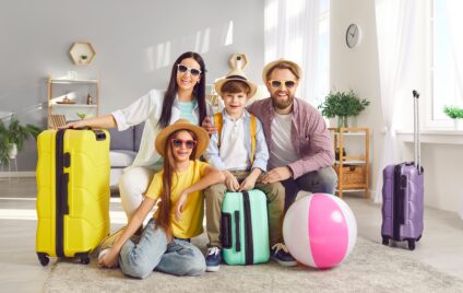 Family arriving at a luxury Miami vacation rental with luggage, ready for a villa getaway.