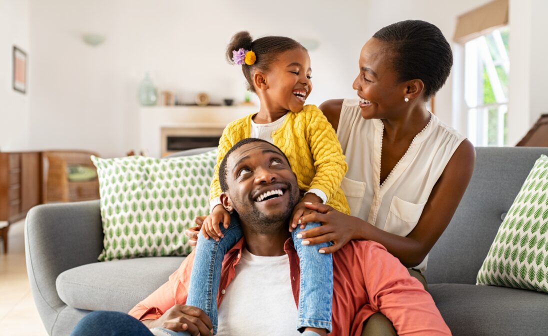 Family enjoying time together in the living room during a relaxing vacation stay.