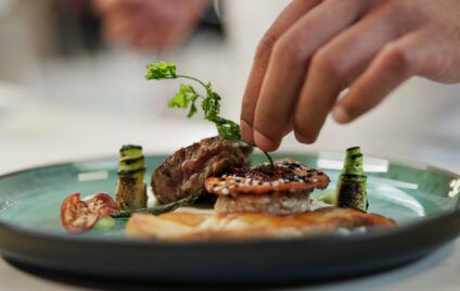 Private chef preparing a gourmet meal in a luxury Miami villa.