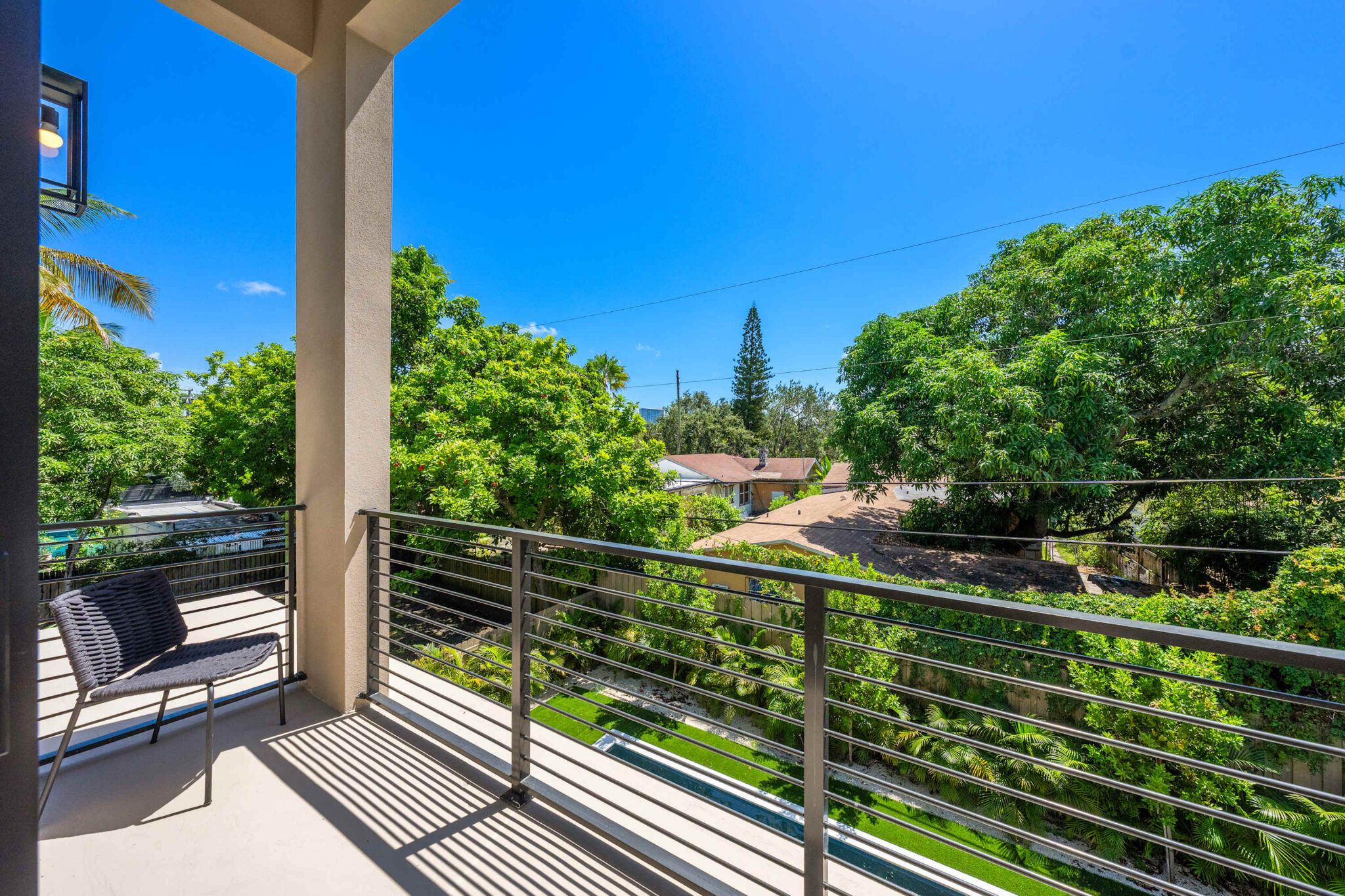 Upper-level balcony with neighborhood view